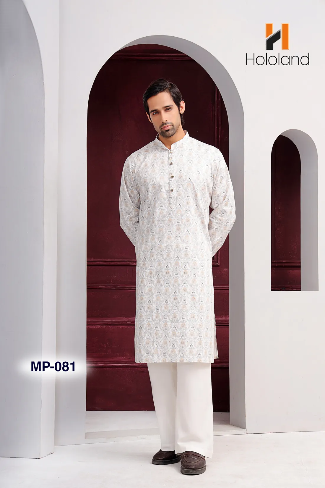 Man in an all-over embroidered white panjabi